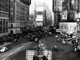 Visitors and Residents of New York City Spend Their Time Window-Shopping Around the Times Square