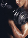 Young Man Exercising with Dumbbells