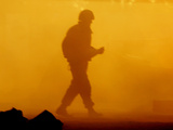 An Israeli Soldier Runs to Reload an Israeli Mobile Artillery Piece
