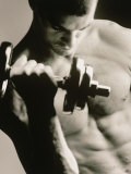 Close-up of a Young Man Working Out with a Dumbbell