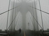 A Lone Runner Makes His Way Across the Fog-Shrouded Brooklyn Bridge Christmas Morning