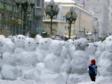 A Child Plays Among the Snowmen Made at the Arbat