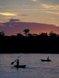 Boaters on Amazon River at Sunset  Amazon River Basin  Peru