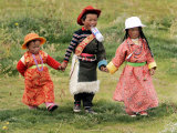 Young Tibetan Children Walk Hand in Hand Near Qinghai Lake