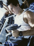 Young Man Exercising with Dumbbells