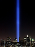 The Tribute of Light Memorial Shines into the Sky Over the Night Skyline of New York City