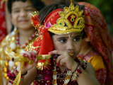 A Child Enacts the Life of Hindu God Krishna During Janamashtami Celebrations