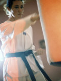 Young Woman Practicing Karate