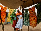 A Sudanese Woman Buys a Dress for Her Daughter at the Zamzam Refugee Camp