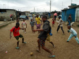 Children Play Soccer in an Impoverished Street in Lagos  Nigeria