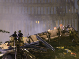 Two New York Firefighters View the Smoldering Rubble