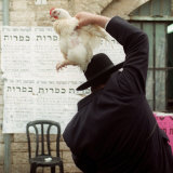 An Ultra Orthodox Man Swings a Live Chicken Over His Head