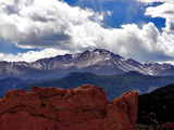 The Sun Breaks Through the Clouds to Highlight the Summit of Pikes Peak