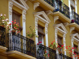 Spain  Sevilla  Andalucia Geraniums hang over iron balconies of traditional houses