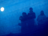 Ultra-Orthodox Jewish Women Seen Through Barrier to Separate Them from the Men