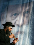 An Ultra-Orthodox Jewish Man Plays a Flute