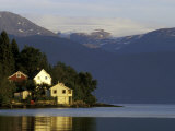 Mountain and Houses Reflecting in Fjord Waters  Norway