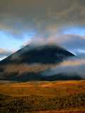 Clouds Over Volcano with Sunlit Plains in Foreground  Tongariro National Park  New Zealand