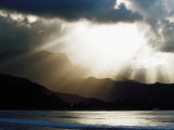 Sun Shining Through Clouds with Mountain Backdrop  Hanalei Beach  Po-Ipu  USA