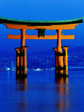 Floating Torii (Gate) at Night with City in Background  Miyajima  Japan