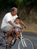 Father and Son Riding a Bicycle  Papeete  French Polynesia