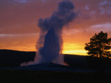 Old Faithful Geyser at Sunset  Yellowstone National Park  USA