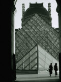 Looking Through an Arched Entrance of the Musee Du Louvre Towards the Glass Pyramid  Paris  France