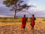 Two Maasai Morans Walking with Spears at Sunset  Amboseli National Park  Kenya