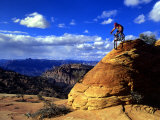 Biker Challenges Slickrock near Rockville  Utah  USA