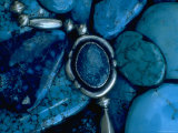 Turquoise Jewelry on Pile of Turquoise Stones Used by Native Americans in Manufacture of Jewelry