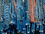 Turquoise and Squash Blossom Necklaces  Made by Native Americans Lining Walls of Store