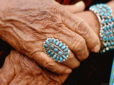 Hands of Navajo Woman Modeling Turquoise Bracelet and Ring Made by Native Americans