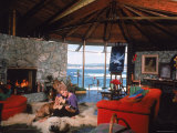 Actress Kim Novak Playing Guitar Beside Pet Great Dane Warlock at Her Home in Big Sur