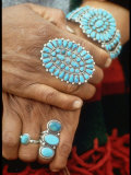 Hands of Navajo Woman Modeling Turquoise Bracelet and Ring Made by Native Americans