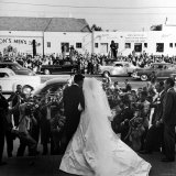 Actress Elizabeth Taylor Wearing Beautiful Long Satin Wedding Gown with Husband Nicky Hilton