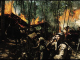 Captain Vernon Gillespie Contacting His Base Camp While Vietnamese Soldiers Burn Viet Cong Hideout