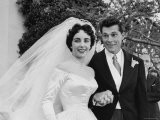 Elizabeth Taylor Wearing Beautiful Satin Wedding Gown with Husband Nicky Hilton Outside Church