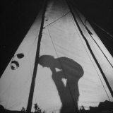 Woman Part of Group Riding Horseback Through Canadian Rockies Settling Into Tent for the Night