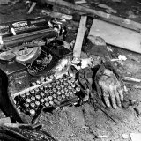 Grotesque Bomb Severed Hand next to German Typewriter in the Rubble of Air Raid by Allied Forces