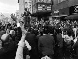 Sen Robert Kennedy Standing on Roof of Car as He is Swamped by a Crowd of Welcoming Well Wishers