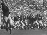 Michigan University's Bob Mann Catching a Pass From His QB Bob Chappuis