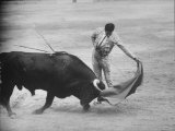 Spanish Matador Antonio Ordonez Executing Left Handed Pass Called "Pase Natural" During Bullfight