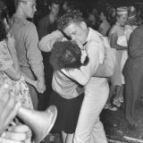 Sailor Kissing Pretty Girl amidst Jubilant Crowd in Celebration Regarding the End of WWII
