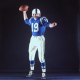 Baltimore Colts Football Player Johnny Unitas in Uniform While Holding Ball in Passing Stance