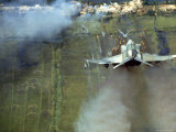 American F4C Phantom Jet Firing Rockets into Viet Cong Stronghold village During the Vietnam War