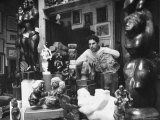 Sculptor Chaim Gross  Posing with His Creations