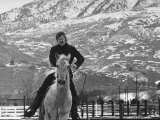 Actor Robert Redford Exercising One of His Eight Saddle Horses on His Remote Mountain Ranch