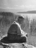 Swiss Psychiatrist Dr Carl Jung Sitting on Stone Wall Overlooking Lake Zurich