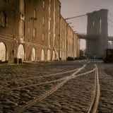 Shuttered Warehouses Lit by Sunlight on Trolley Track Railed Street Along Brooklyn Waterfront