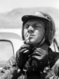 Actor Steve McQueen Putting on Helmet During 500 Mi Motorbike Race Across Mojave Desert